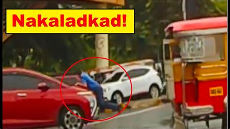MMDA traffic enforcer nakaladkad ng sasakyan sa Taguig.
